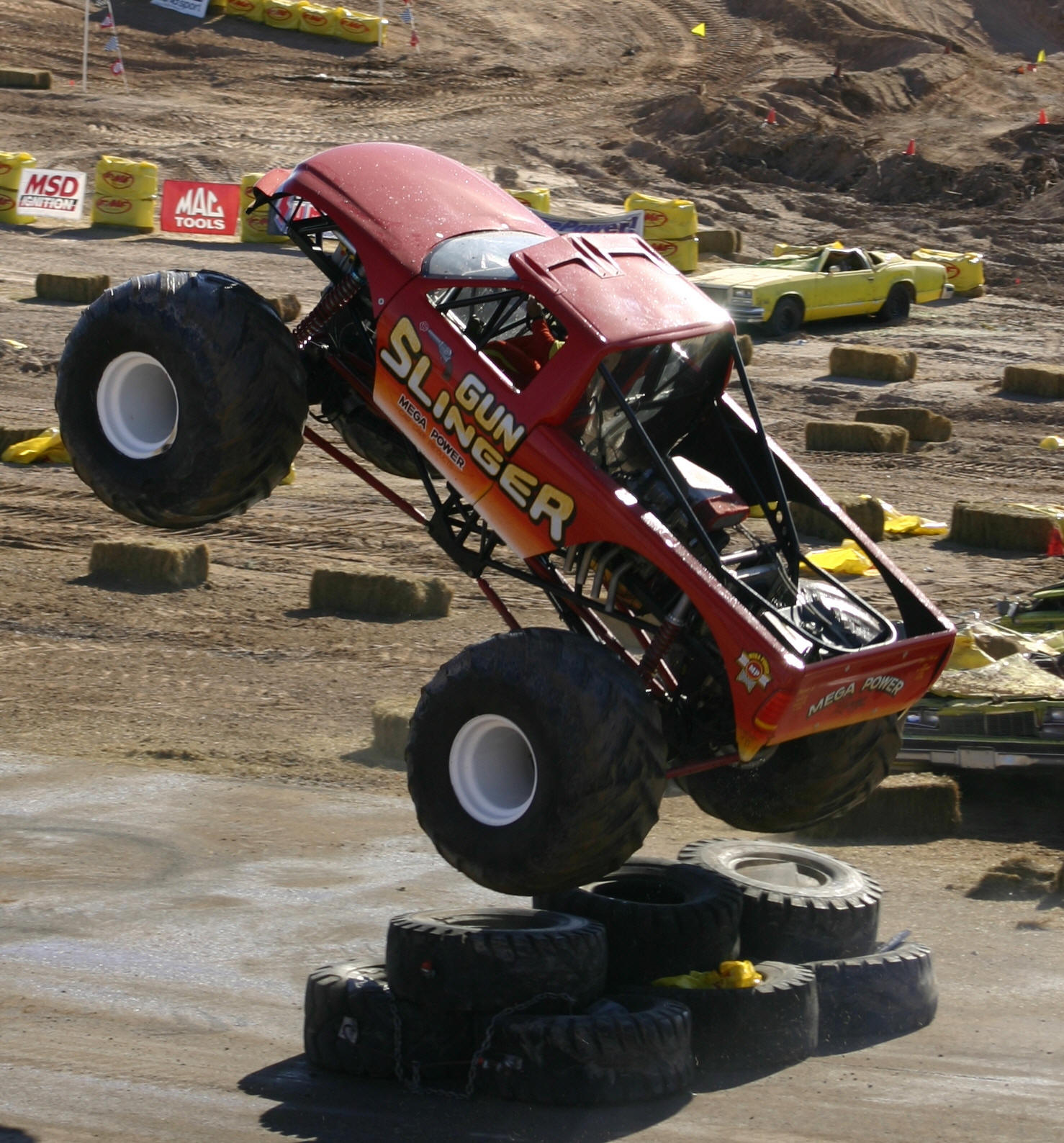 Gun Slinger Monster Truck goes airborne to clear some tires