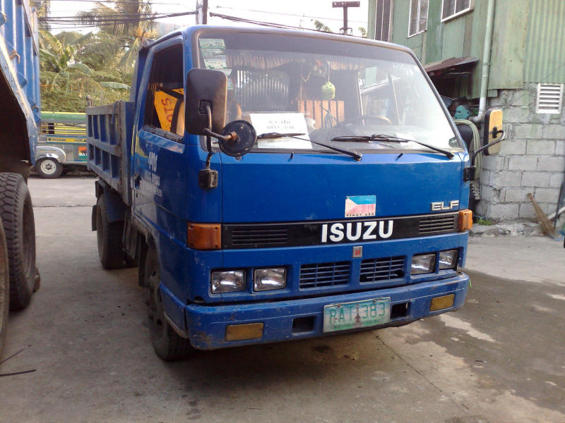 Little Blue Isuzu Elf panel dump truck